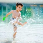 Boy splashing in water