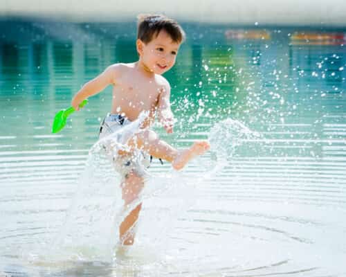 Boy splashing in water