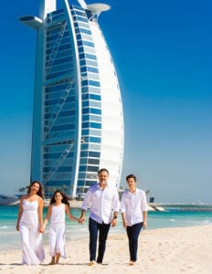 colour photo of family on a beach in Dubai