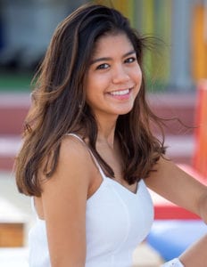 portrait of a senior college girl outside a coffee shop in Dubai