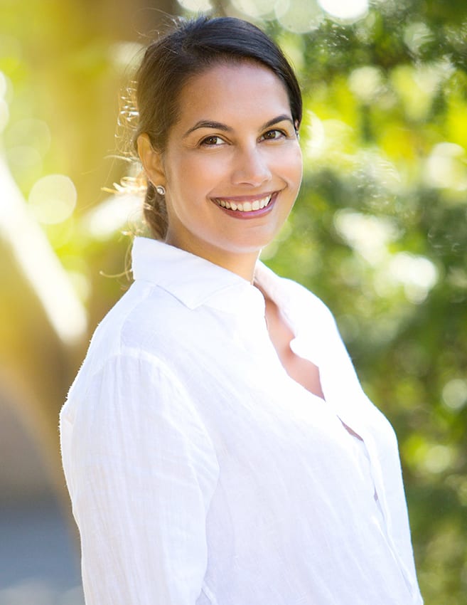 natural light portrait photo of a woman in a white shirt taken in Surrey