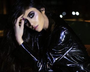 photo of model wearing a Leyla Diamondi pvc coat