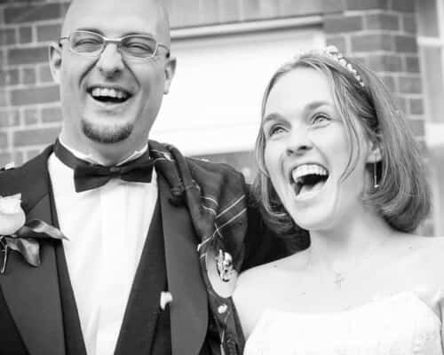 laughing bride and groom